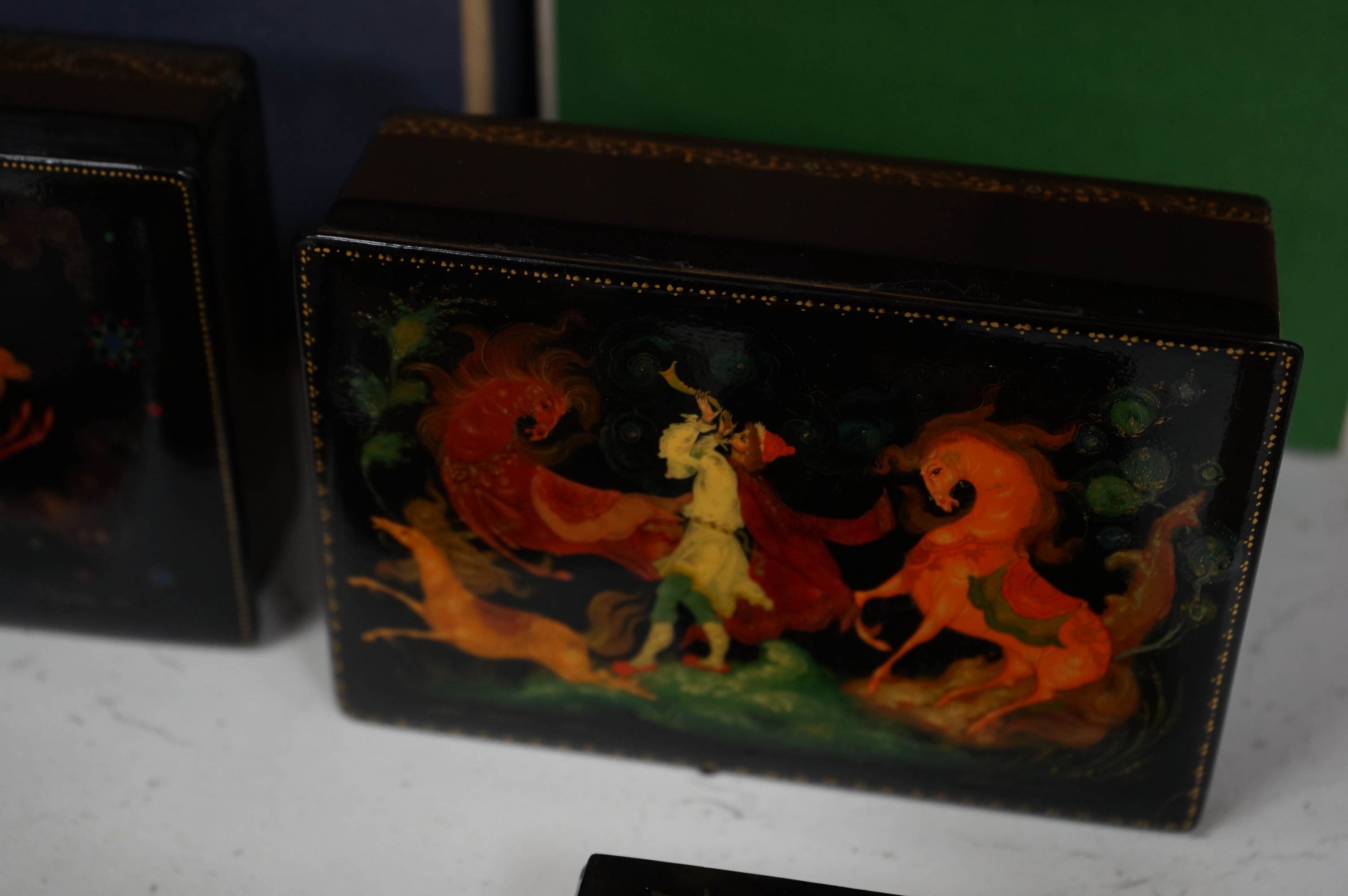 Six late 19th / early 20th century Russian lacquer boxes to include a circular example, largest 15cm wide. Condition - good